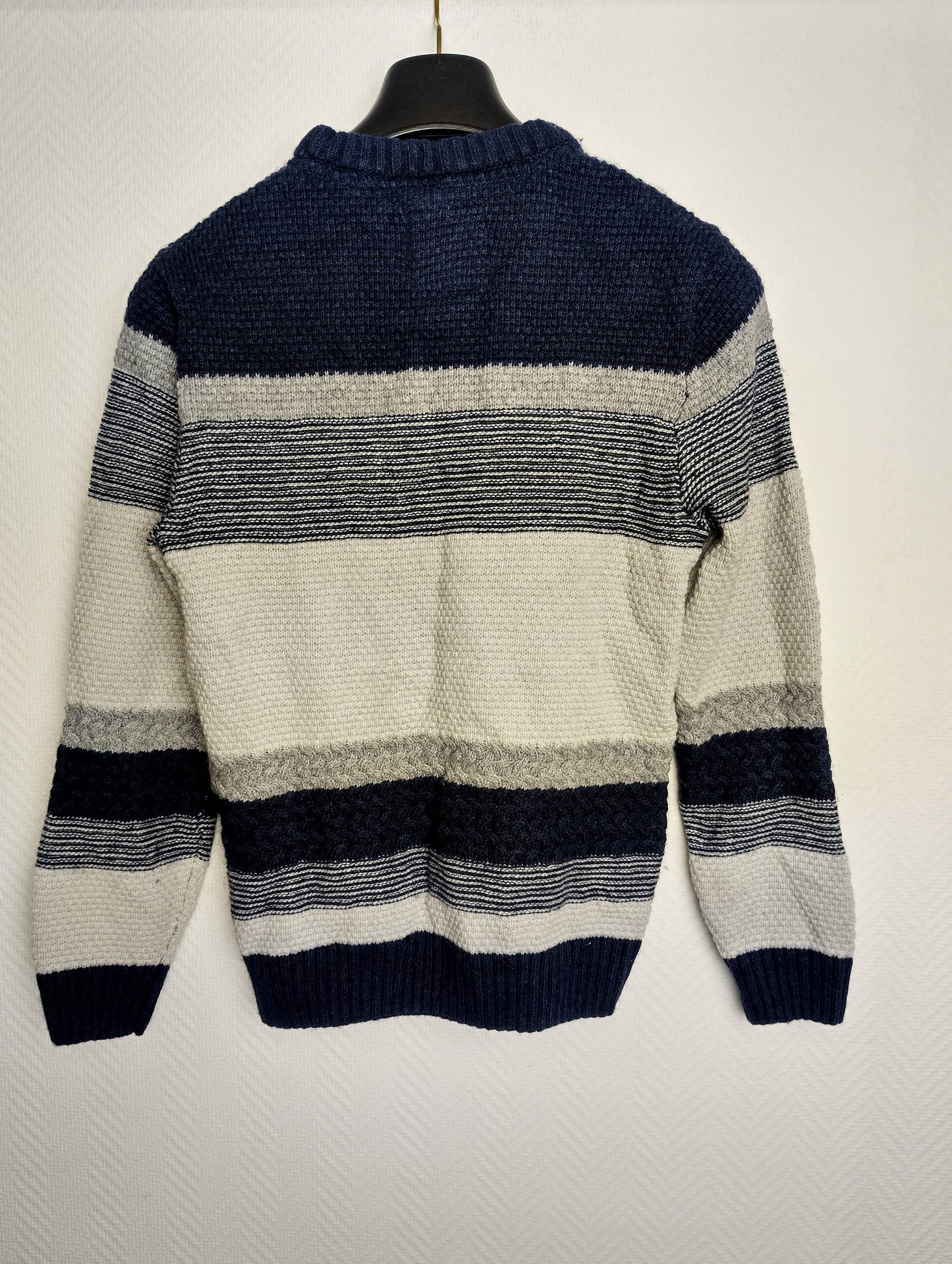 Back view of the striped knit sweater