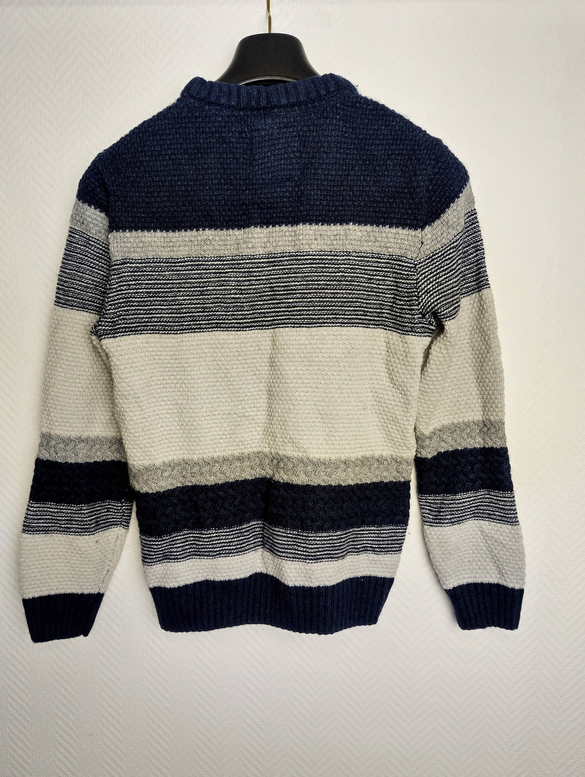 Back view of the striped knit sweater