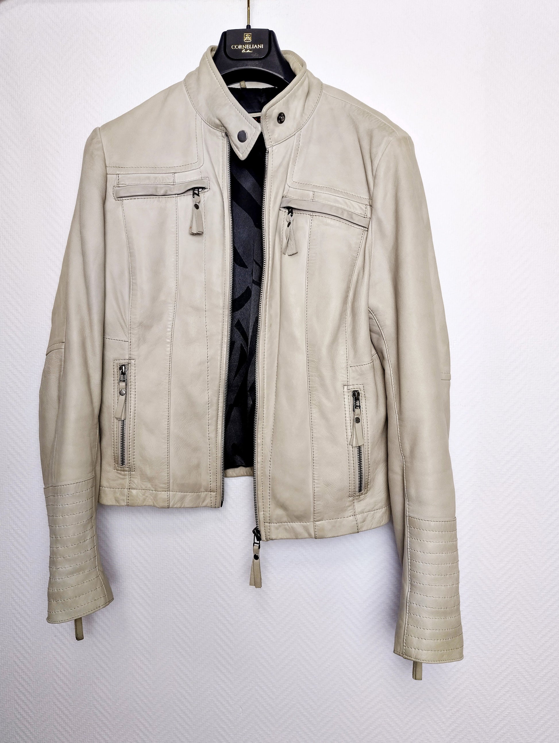 Front view of stylish light gray leather jacket