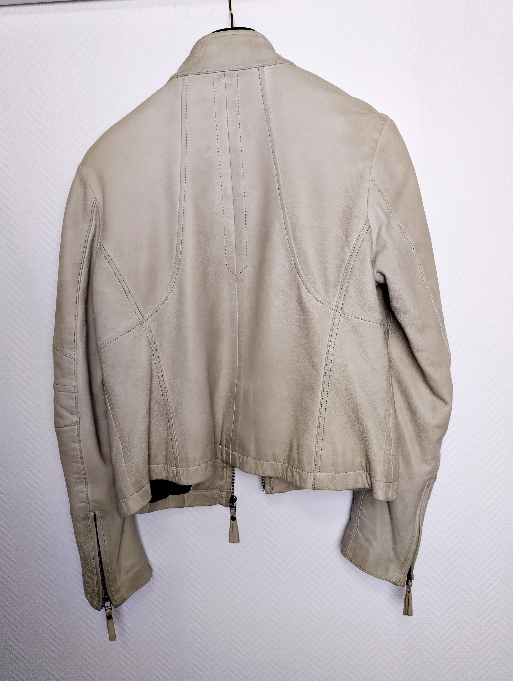Back view of light gray leather jacket
