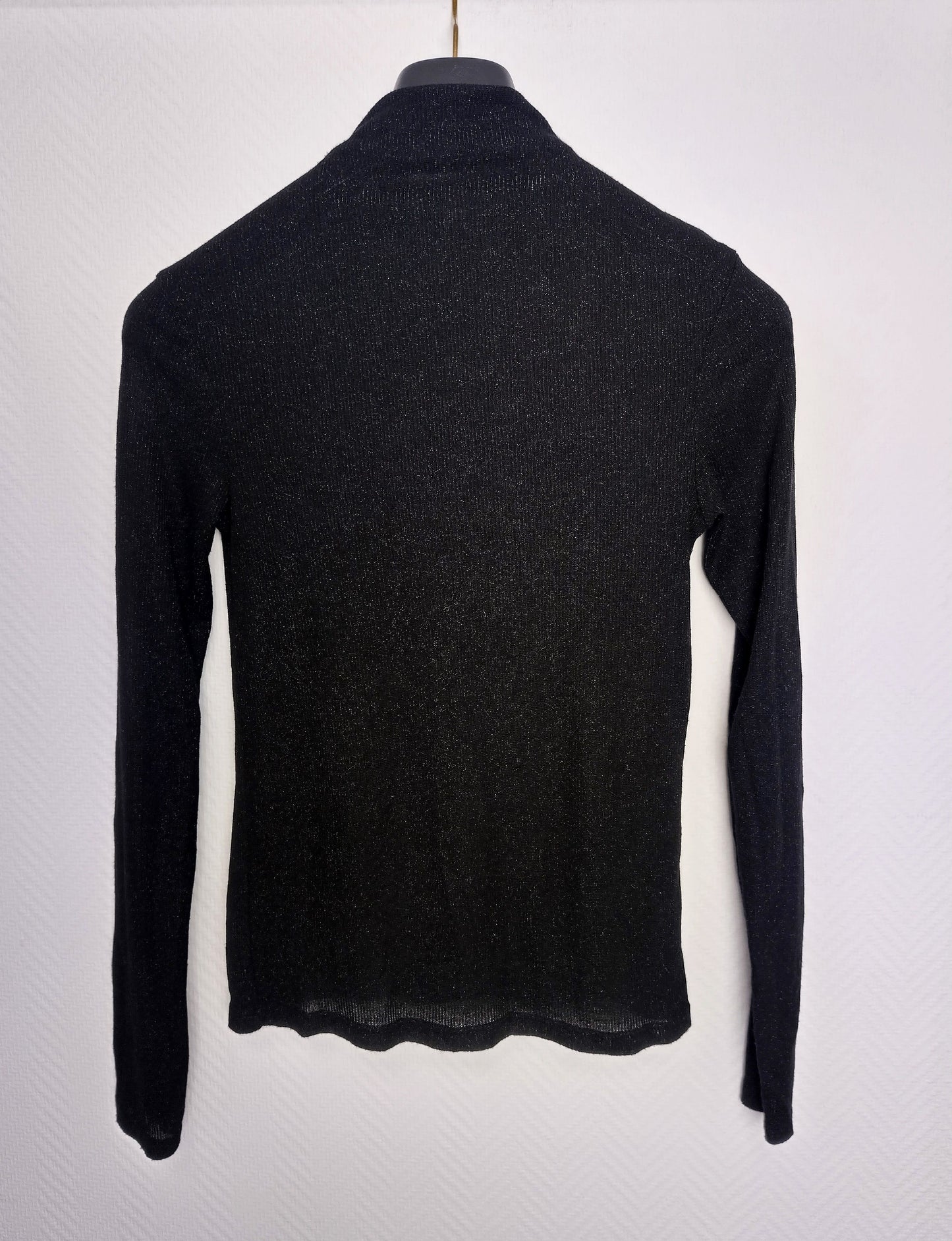 Another back view of black long sleeve top