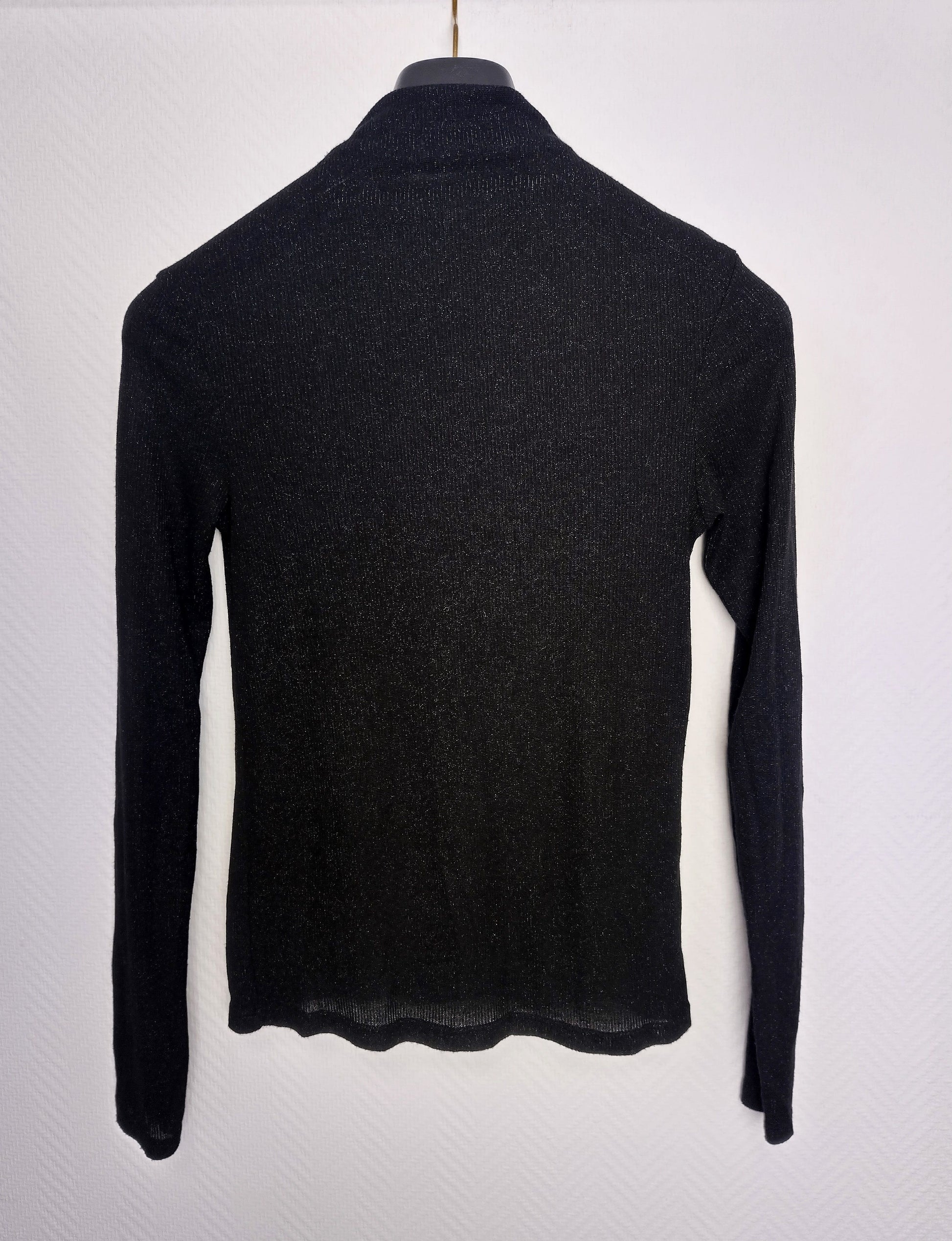 Another back view of black long sleeve top