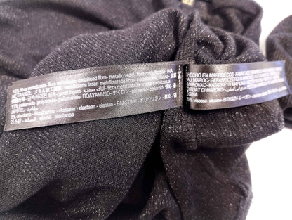 Care instructions label on black long sleeve top