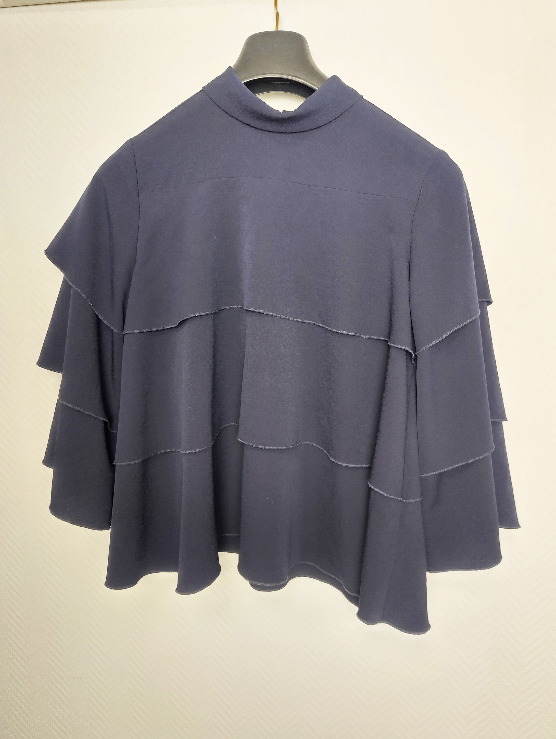 Back view of navy layered top