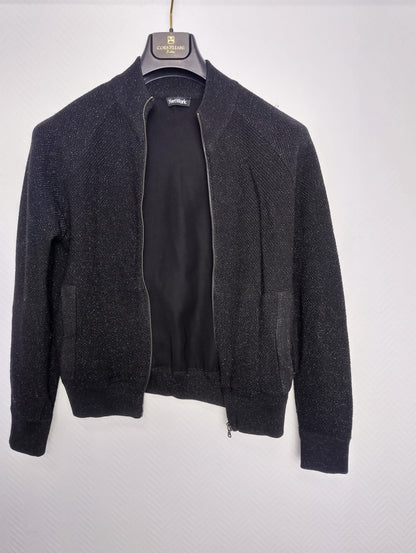 Front view of the black zip-up jacket
