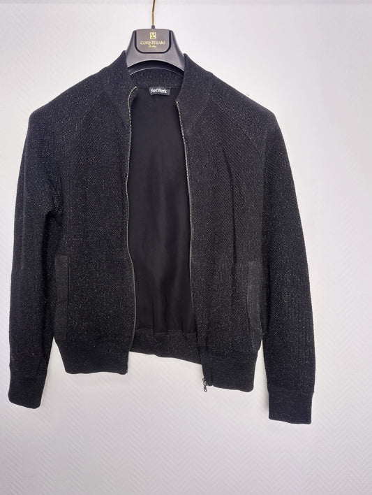 Front view of the black zip-up jacket