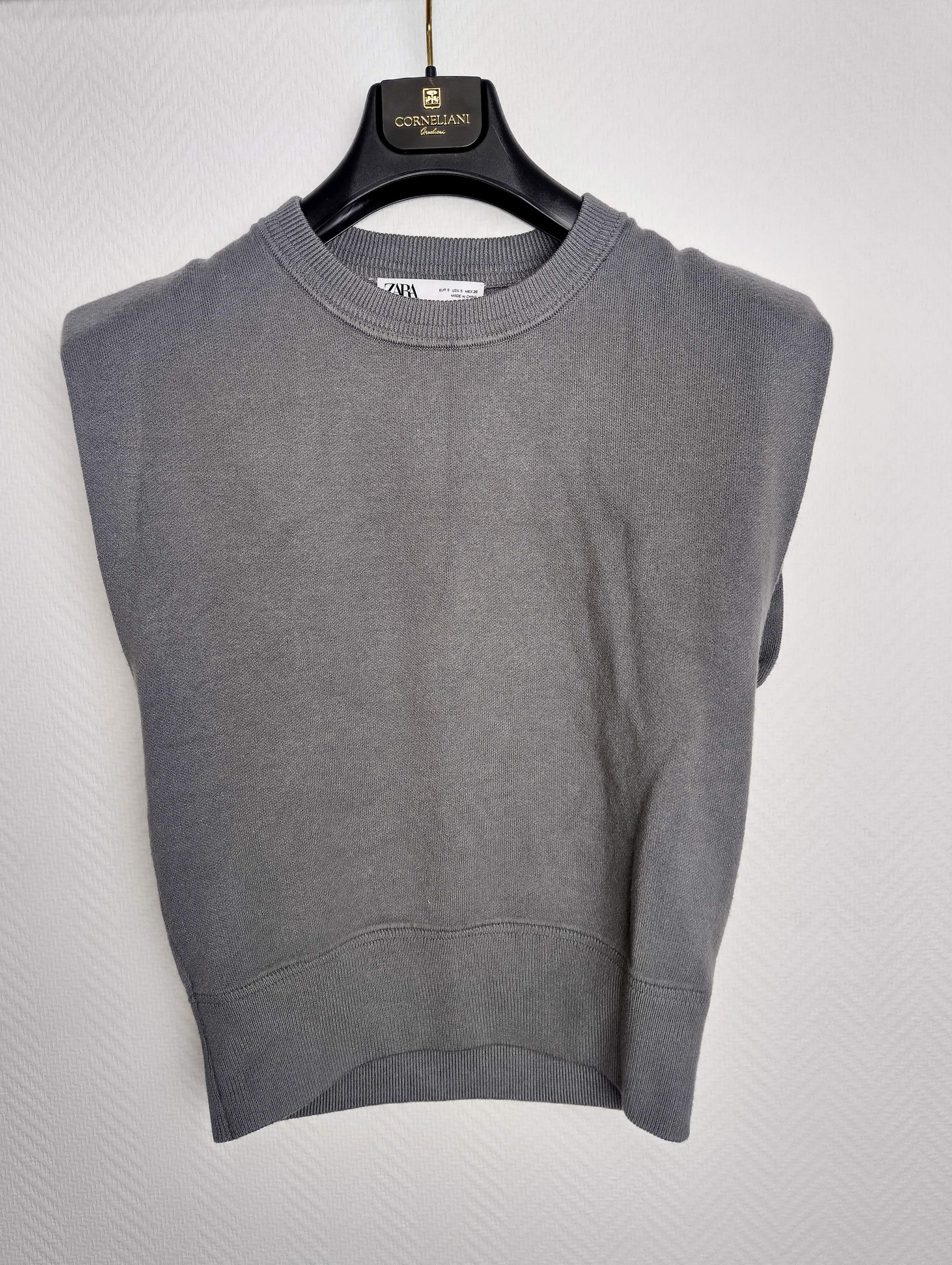 Front view of grey sleeveless sweater