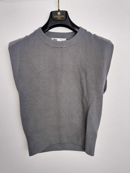 Front view of grey sleeveless sweater