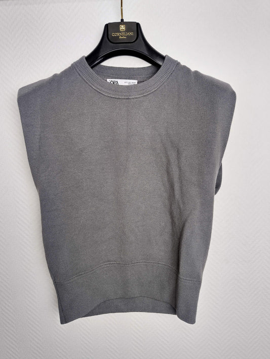 Front view of grey sleeveless sweater