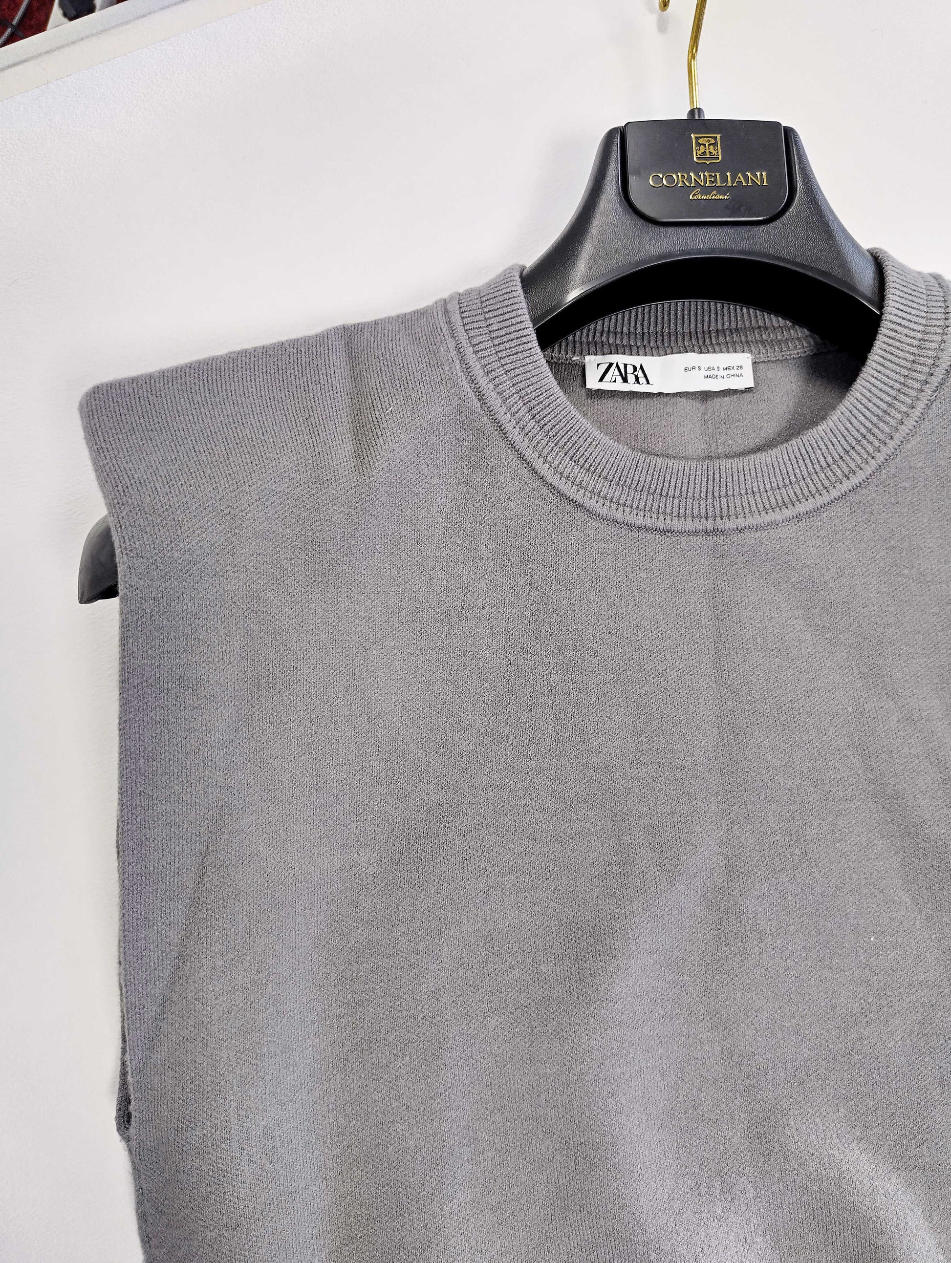 Close-up of grey sweater showing neckline