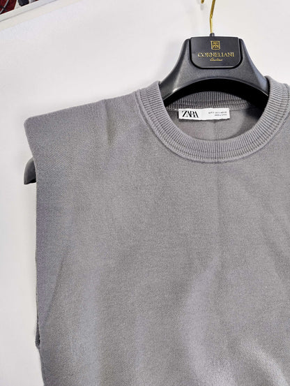 Close-up of grey sweater showing neckline