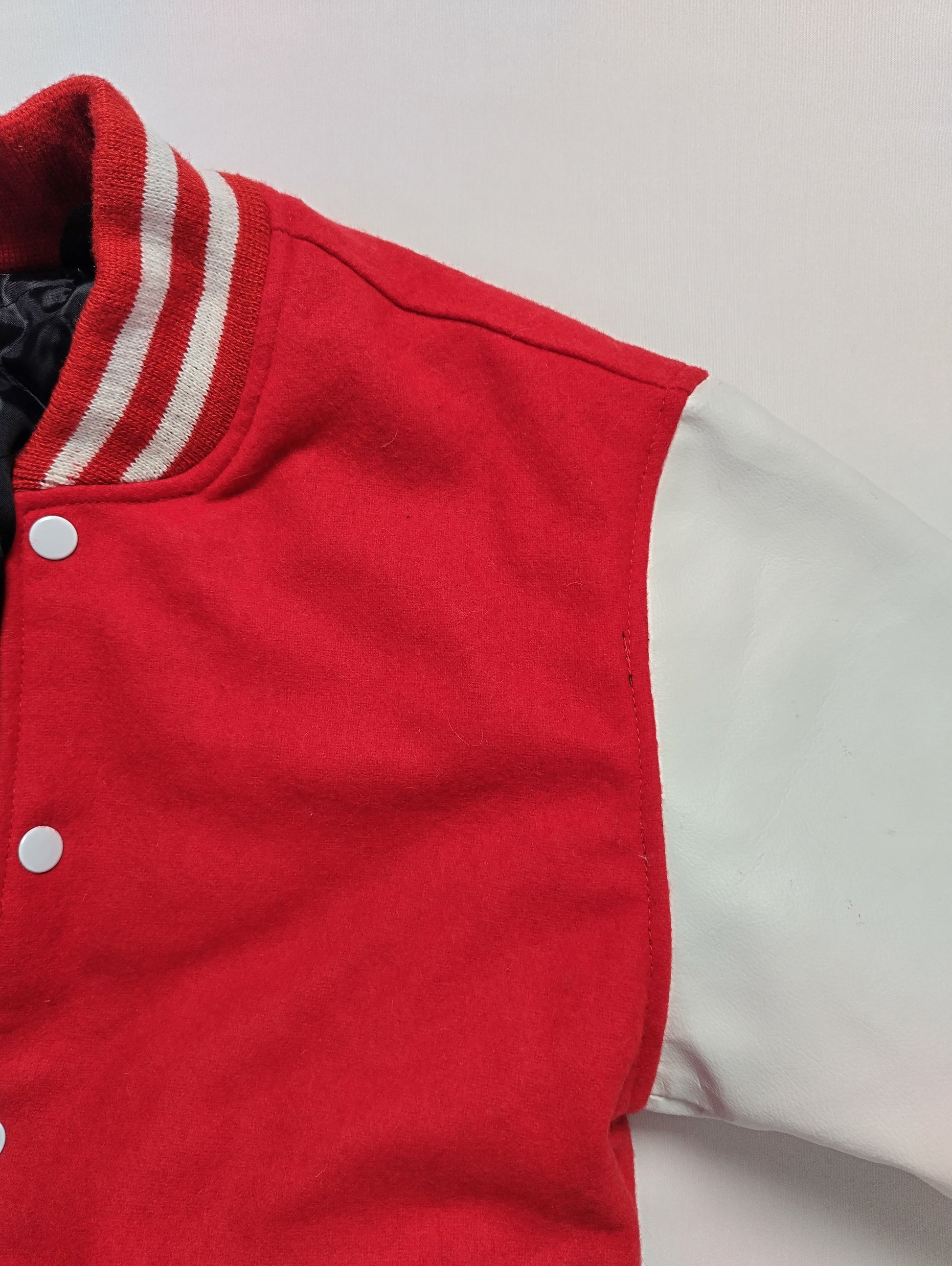 Close-up of red and white varsity jacket