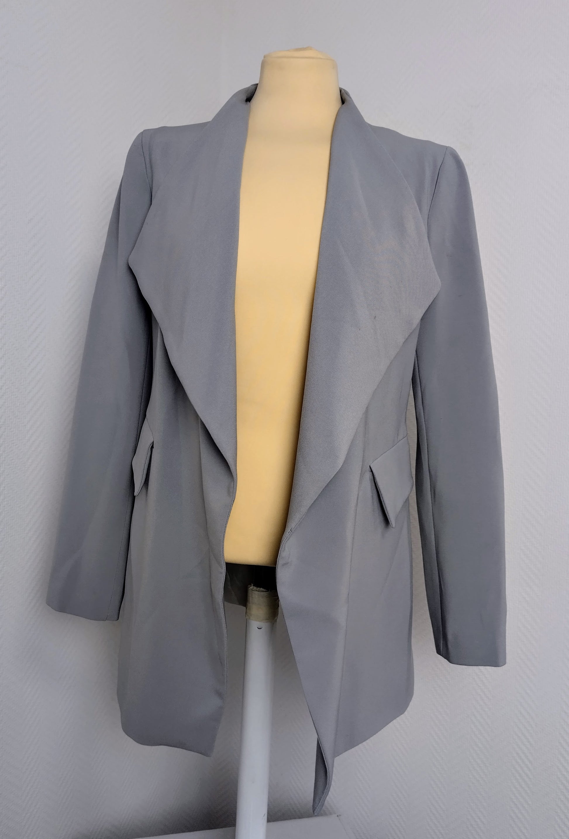 Front view of gray blazer on a mannequin