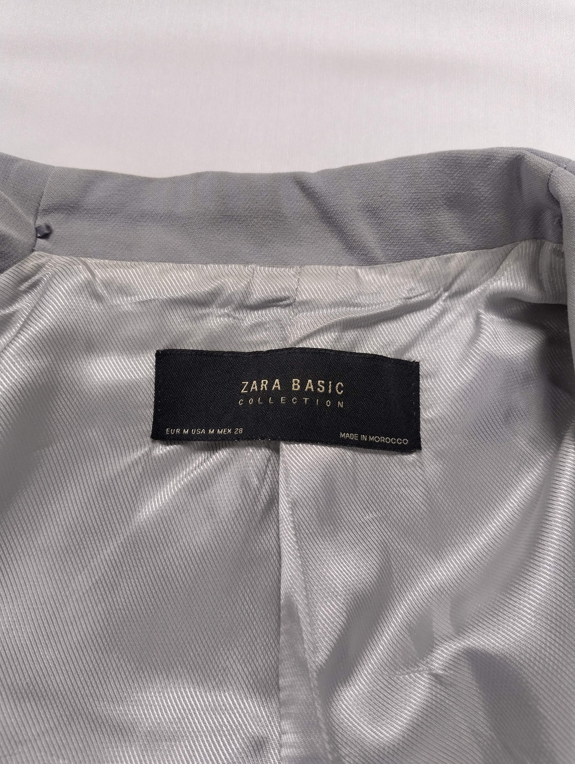 Close-up of Zara Basic label inside gray blazer