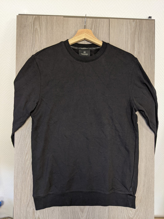Front view of black sweater hanging