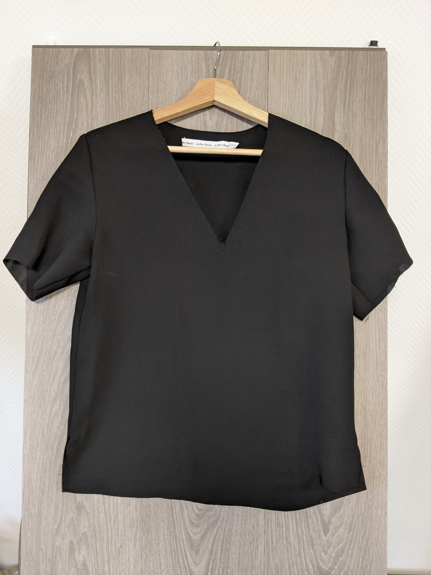 Black V-neck top front view