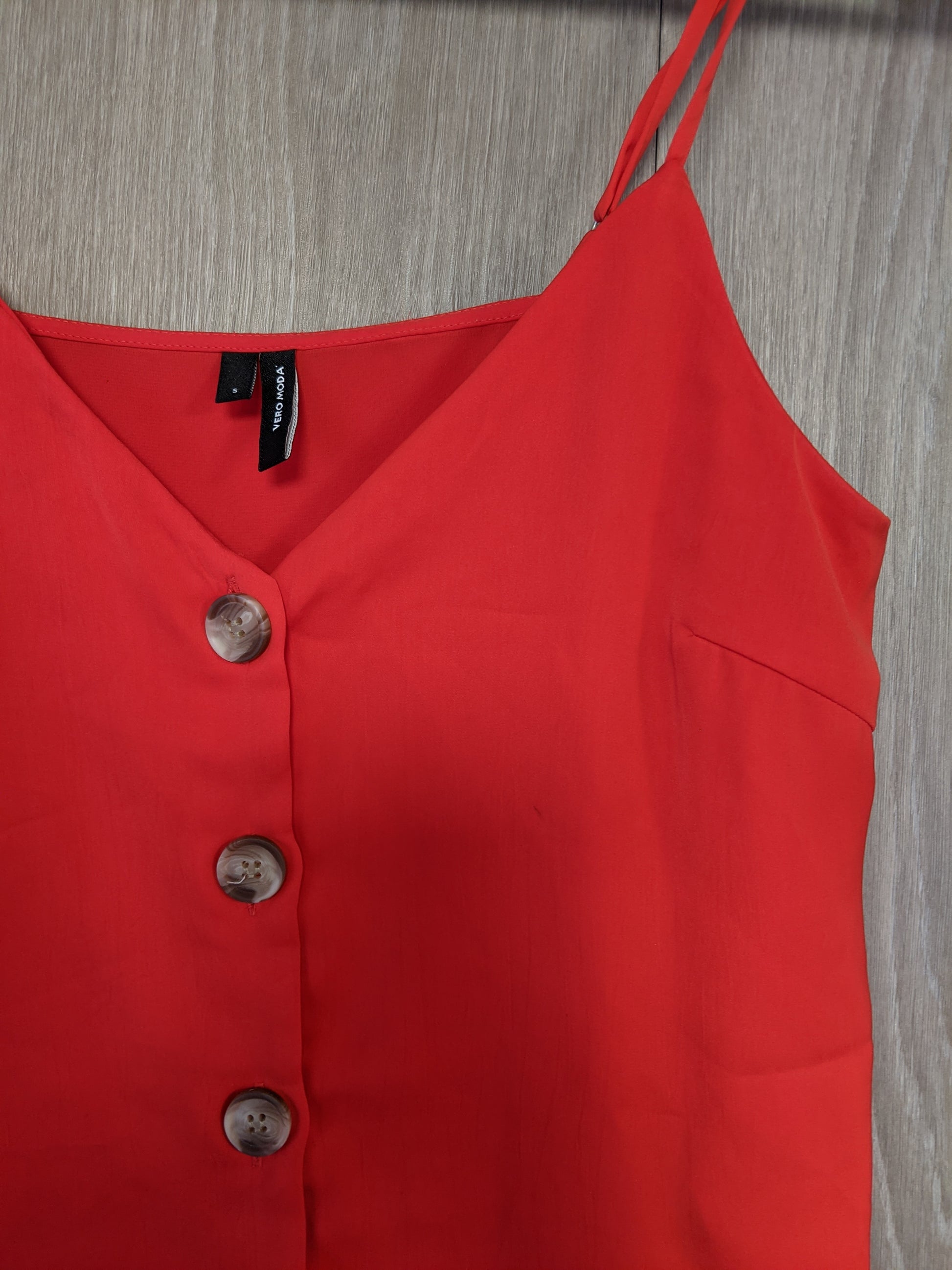 Close-up of the top and button detail