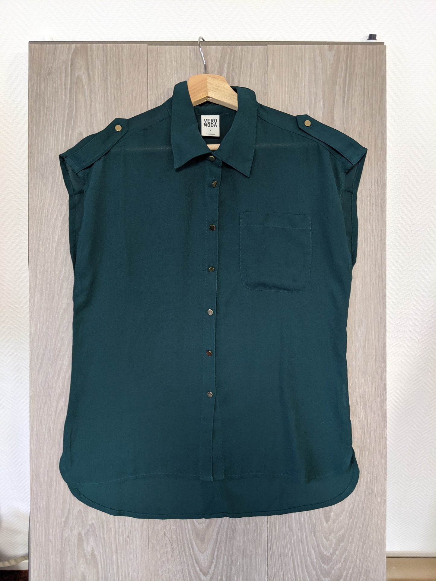 Front view of the dark green shirt