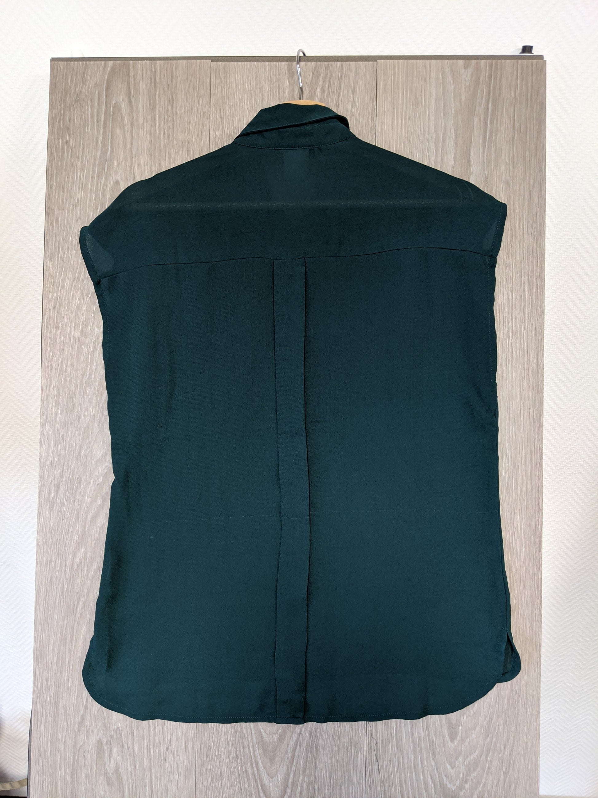 Back view of the dark green shirt