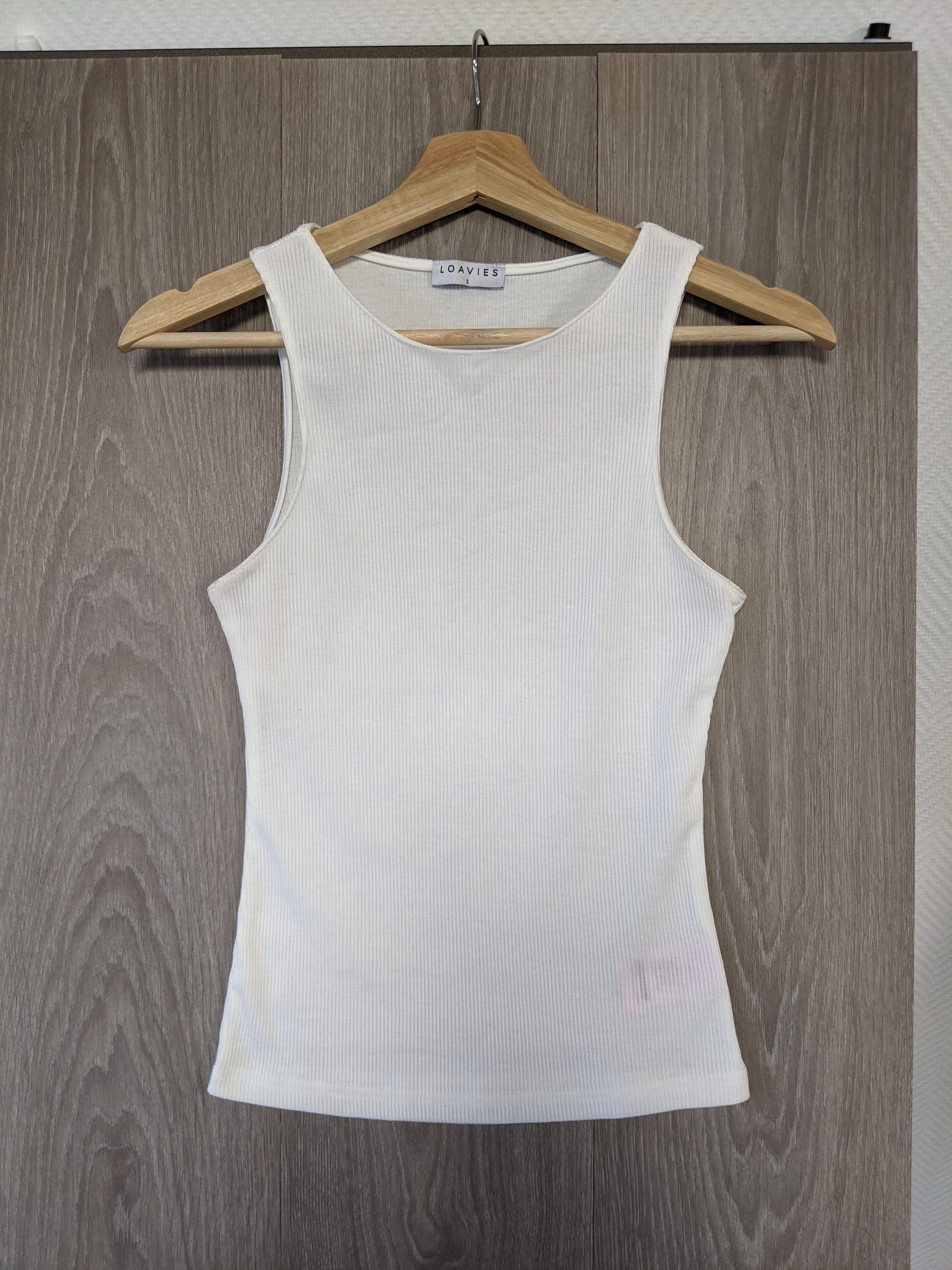 Front view of Loavies white ribbed tank top