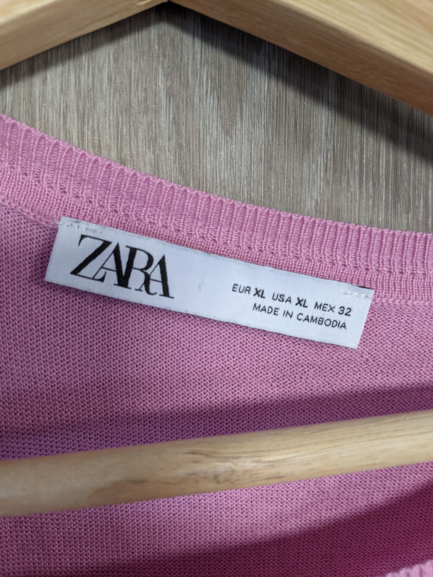 Close-up of the label on the pink sweater
