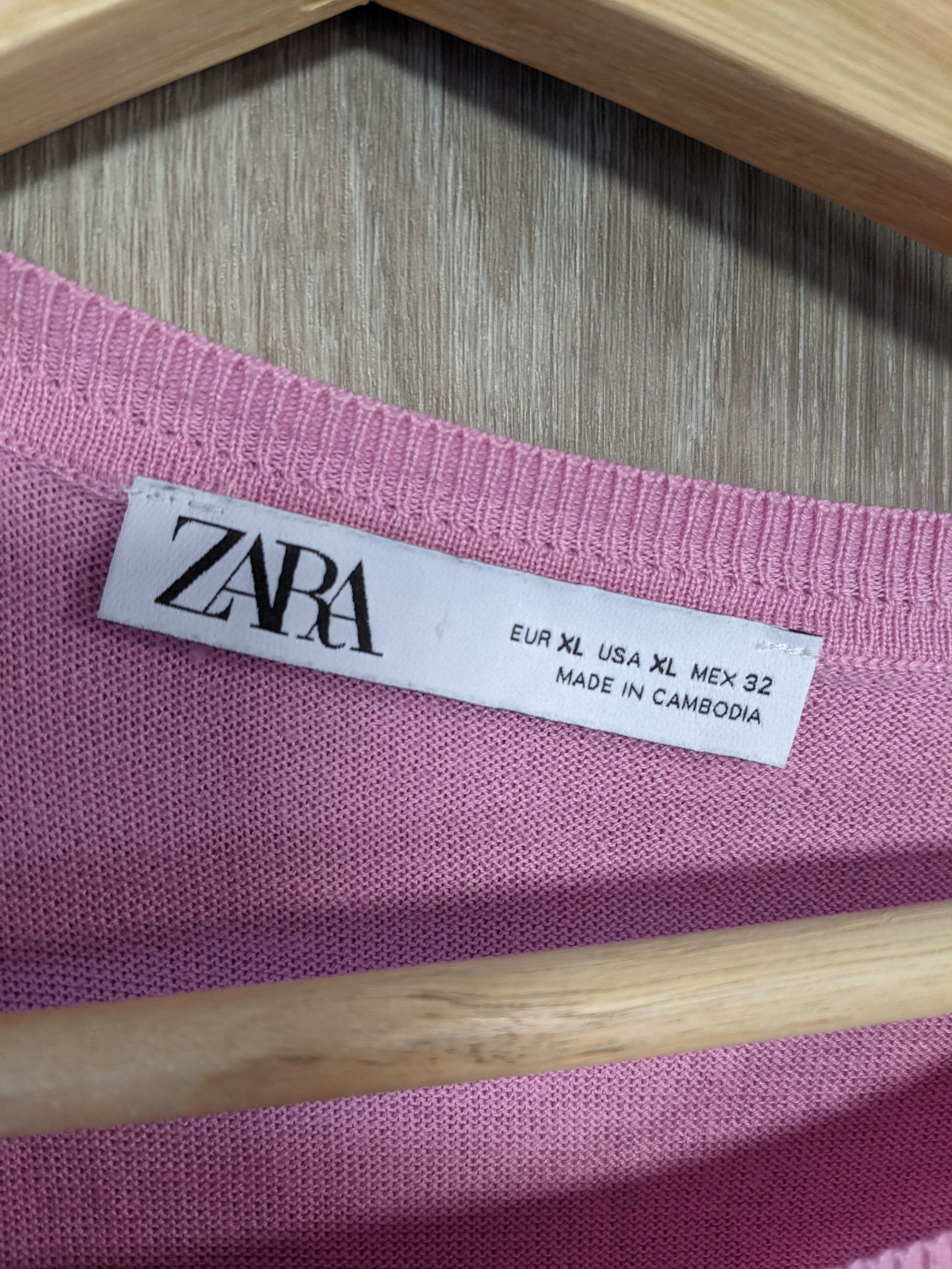 Close-up of the label on the pink sweater