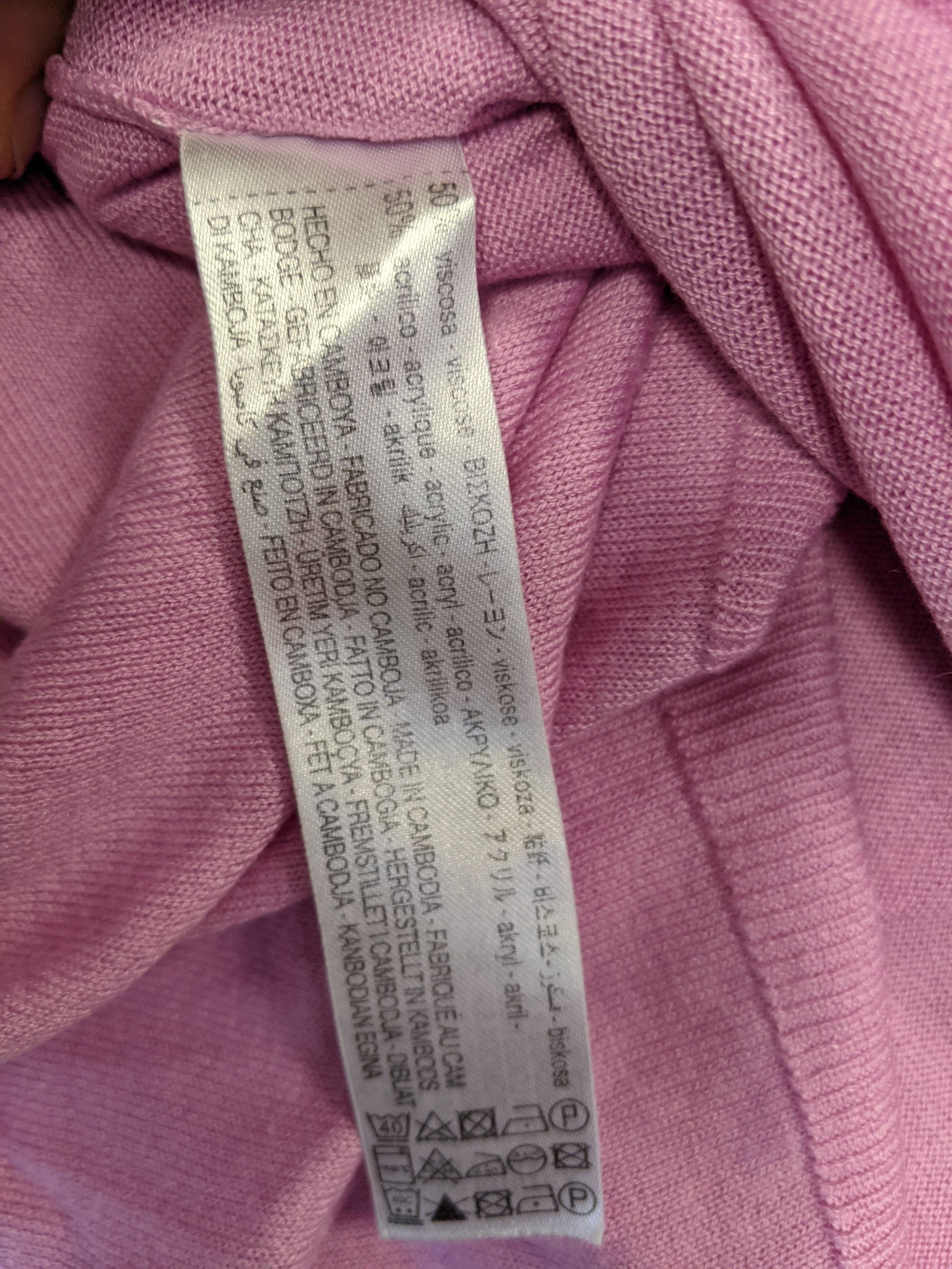 Care label of the pink sweater