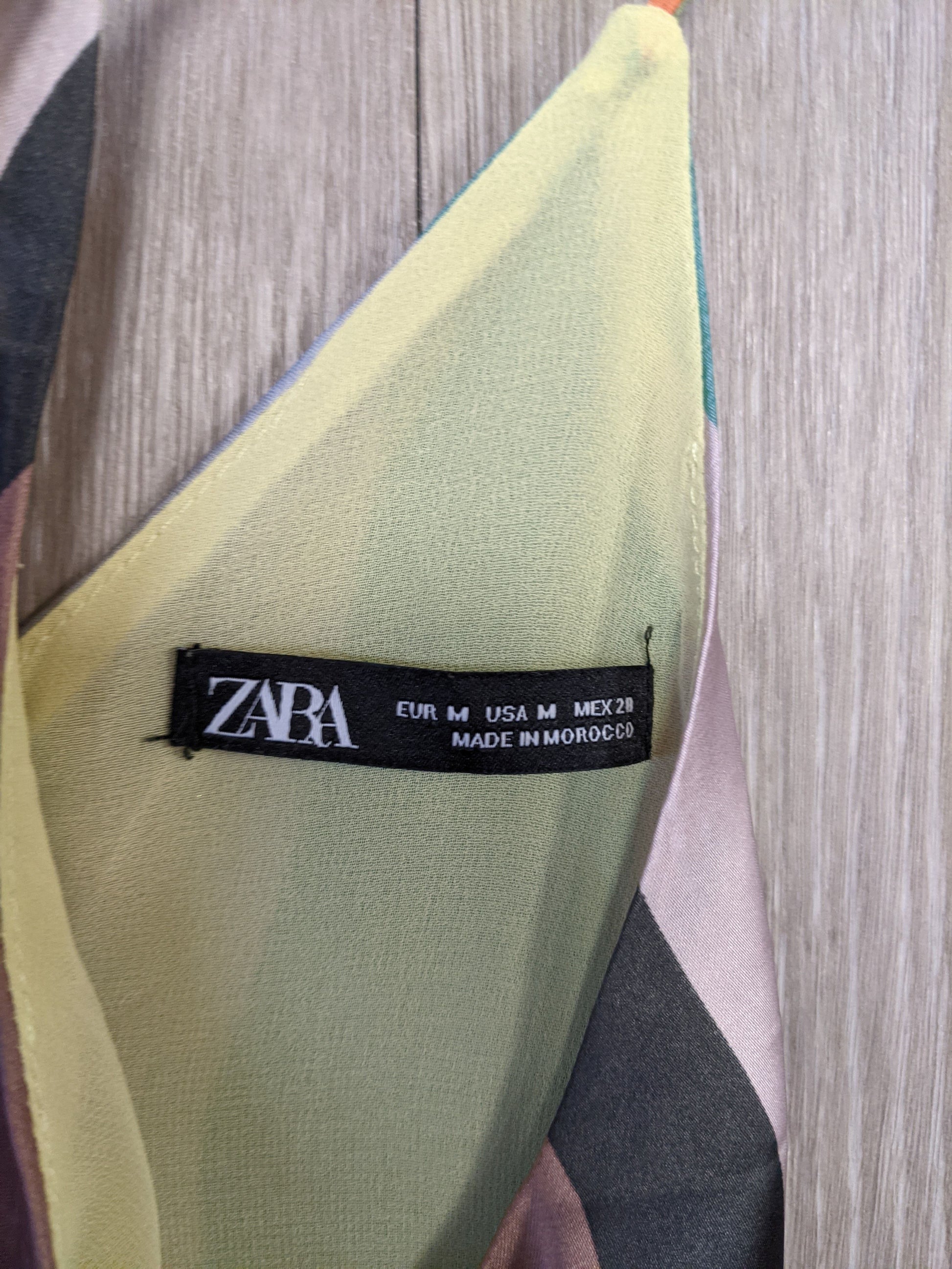 Close-up of care tag on striped top