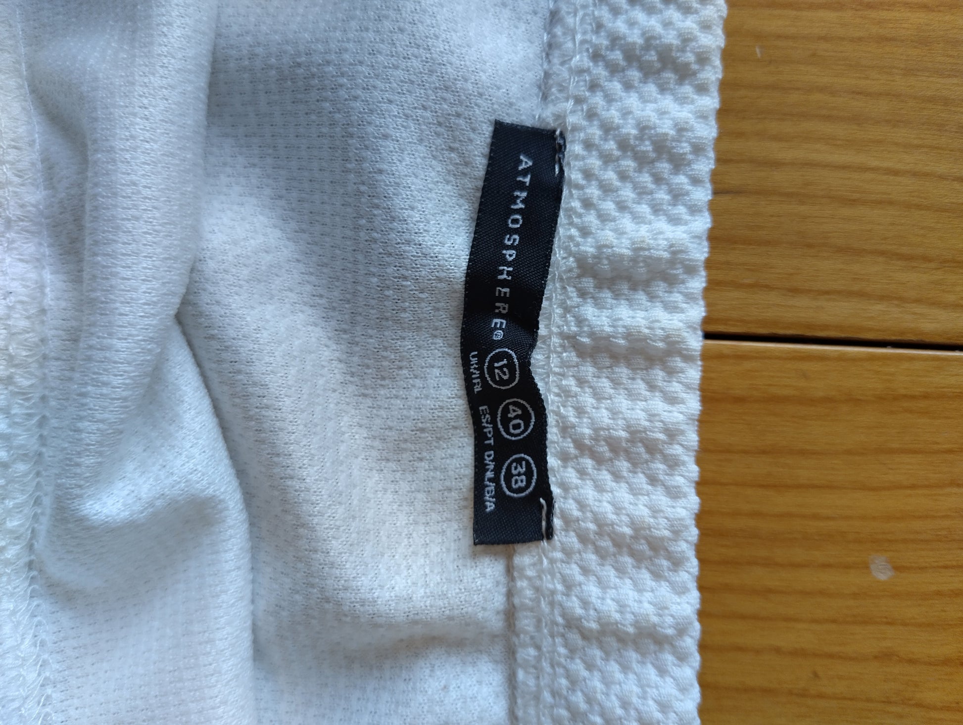 Close-up of Atmosphere tag on the skirt