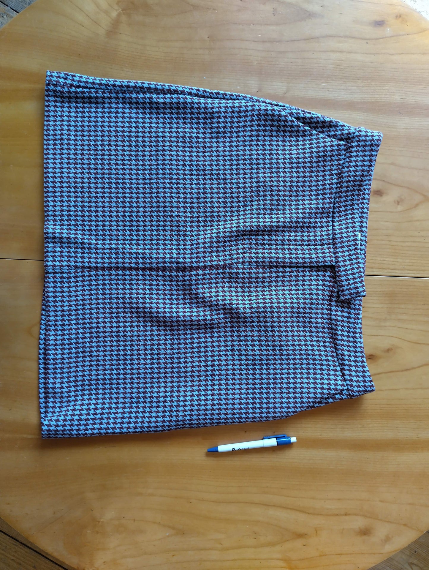 Houndstooth skirt laid flat on a table