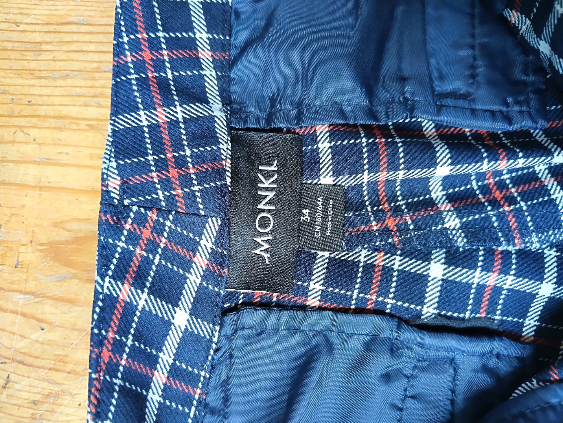 Close up of Monki label on plaid pants