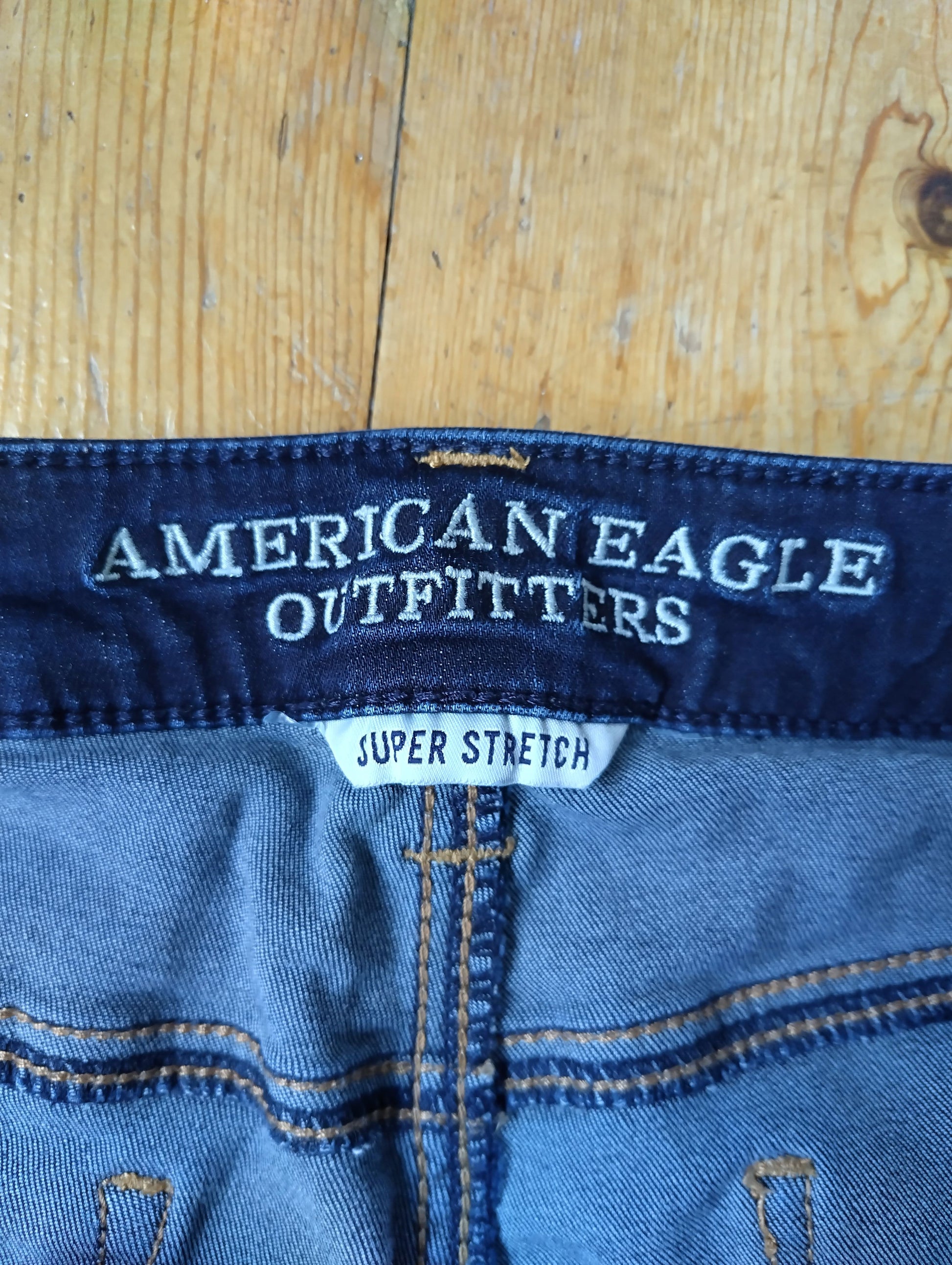 Close-up of American Eagle branding on jeggings