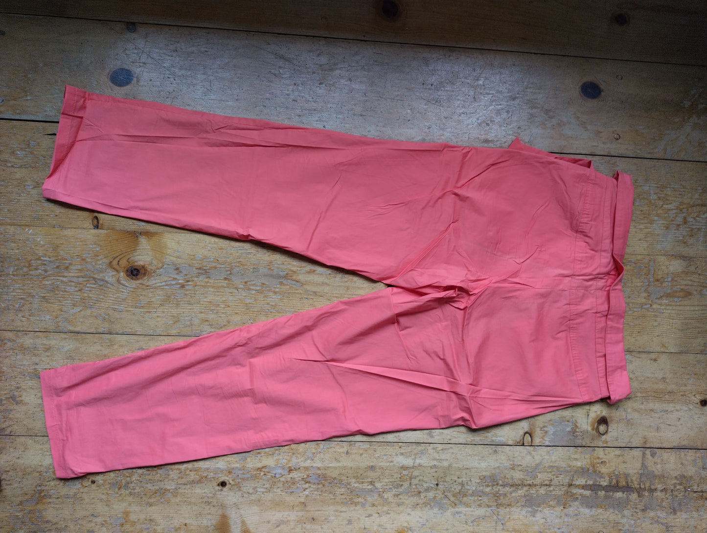 Back view of the pink belted trousers