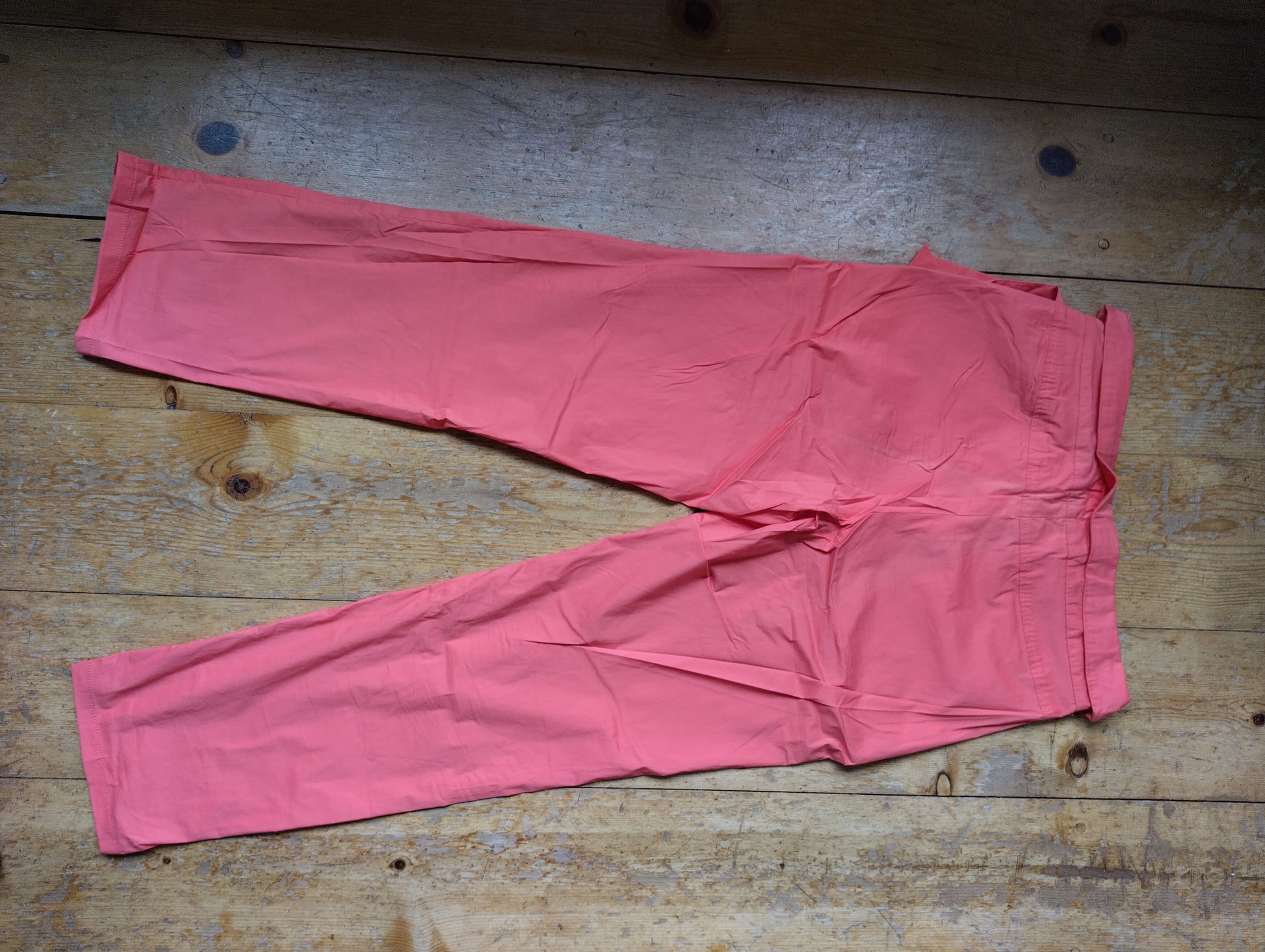 Back view of the pink belted trousers