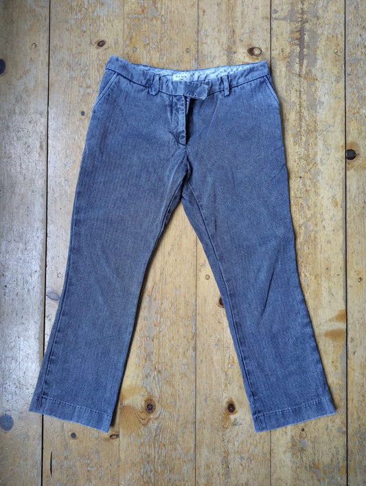 Front view of blue trousers on a wooden floor