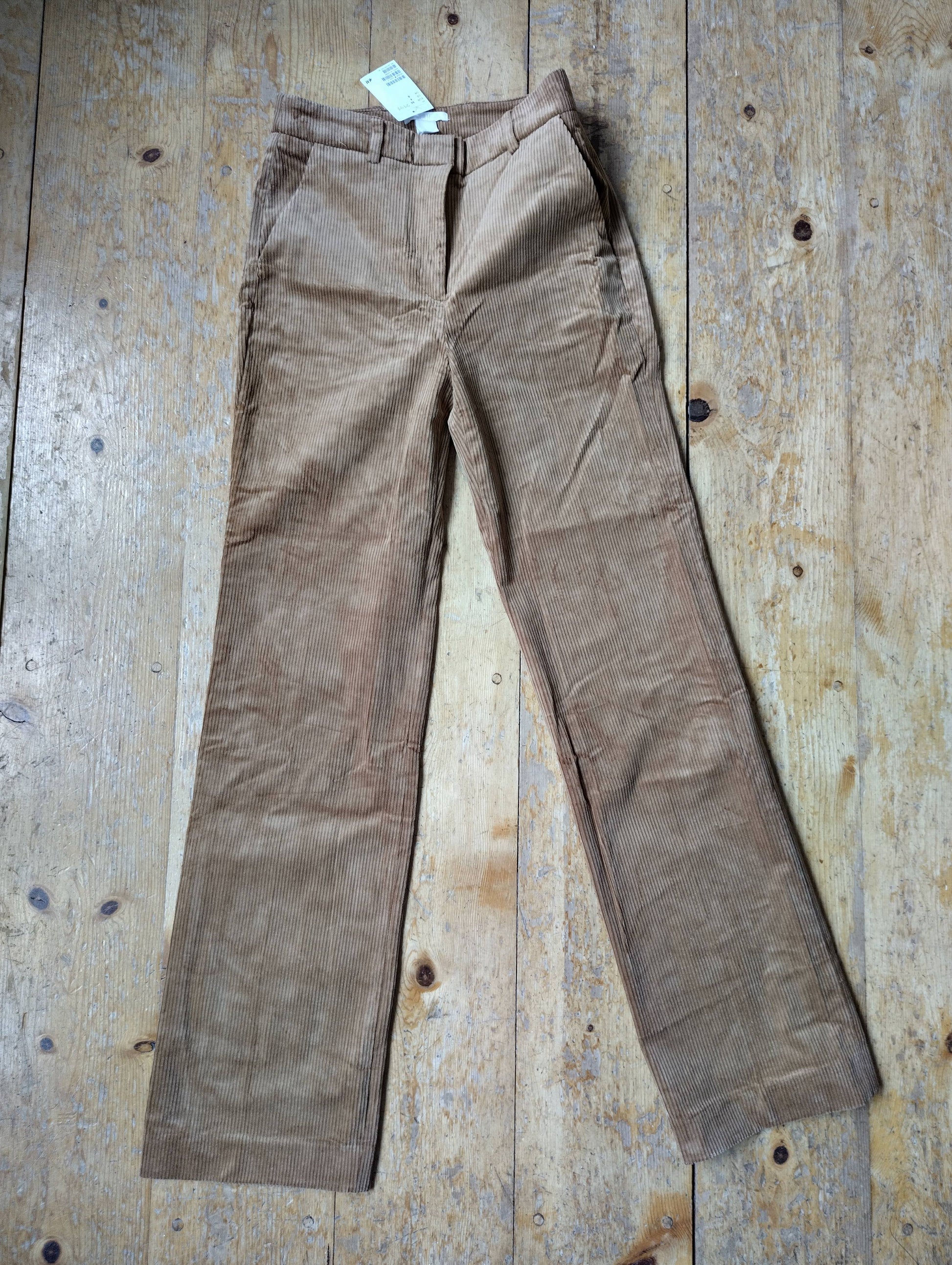 Front view of tan corduroy trousers