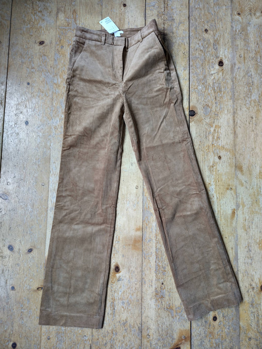Front view of tan corduroy trousers