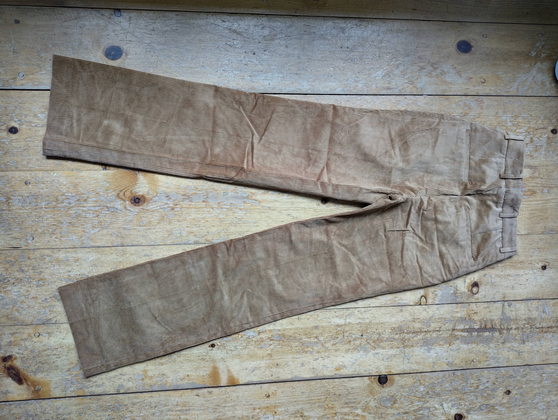 Back view of tan corduroy trousers
