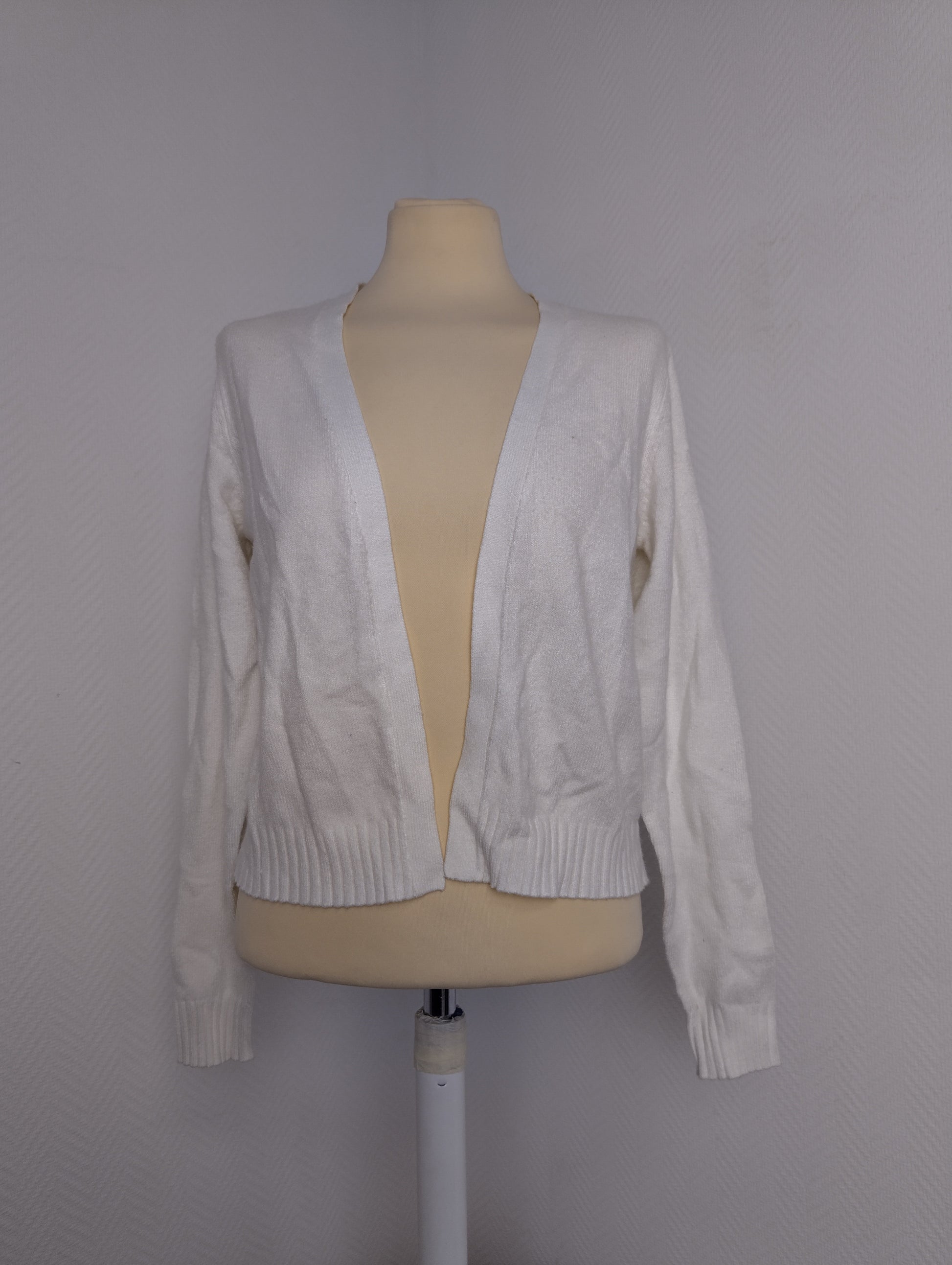 Front view of white cardigan on mannequin