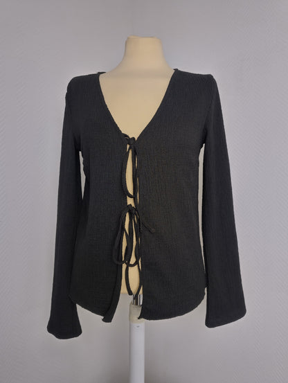 Black long sleeve top on mannequin
