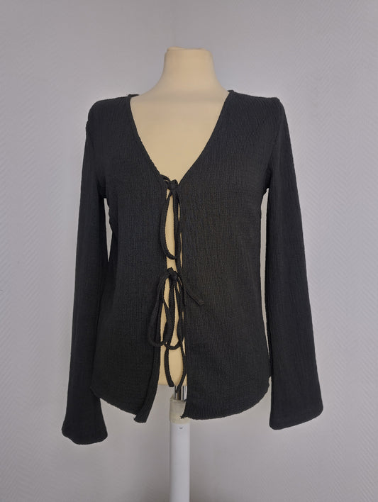 Black long sleeve top on mannequin