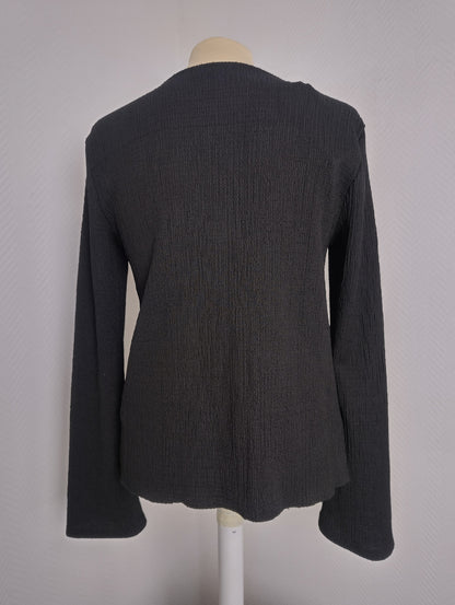 Back view of black long sleeve top