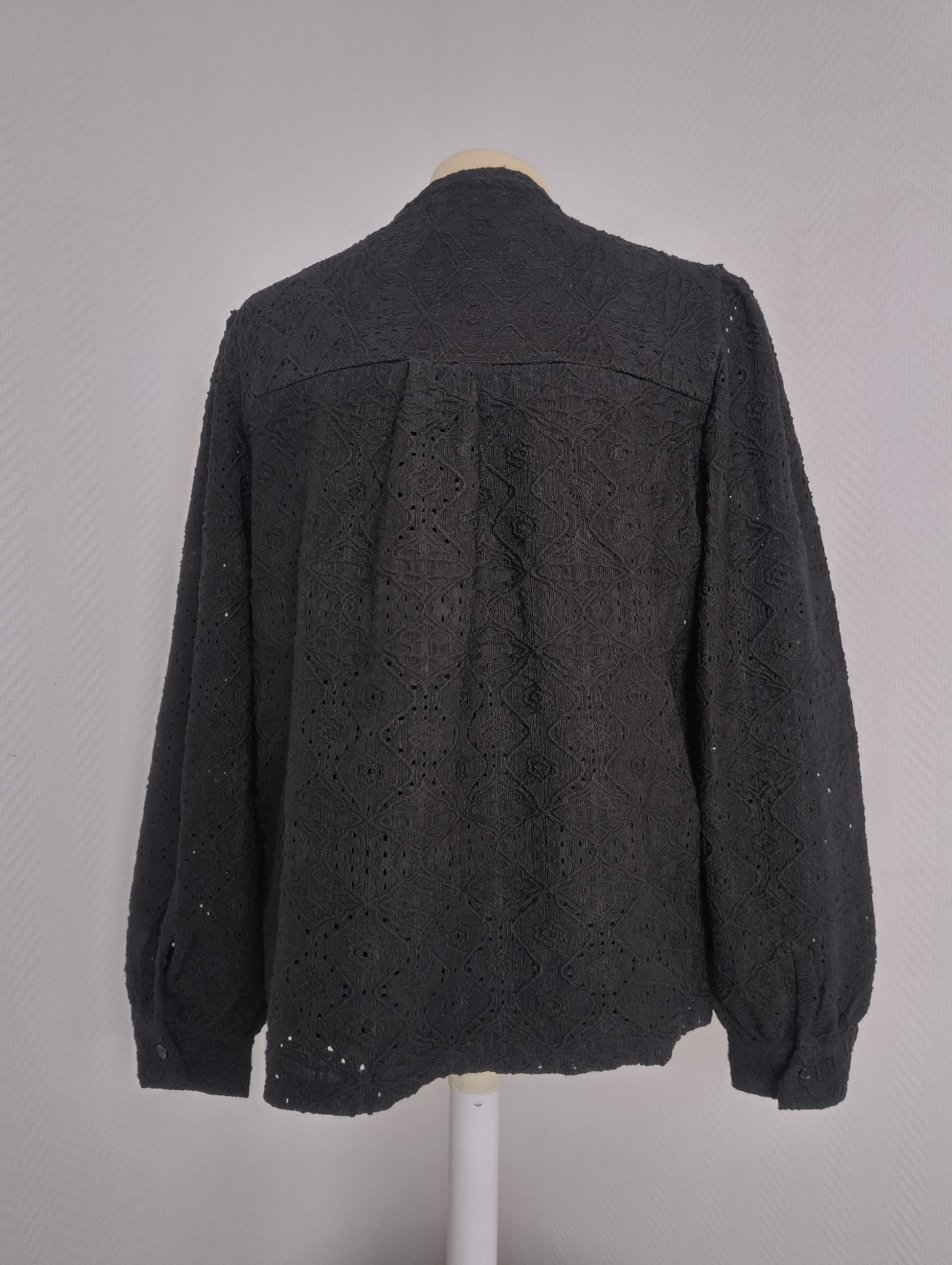 Back view of black embroidered long-sleeve shirt