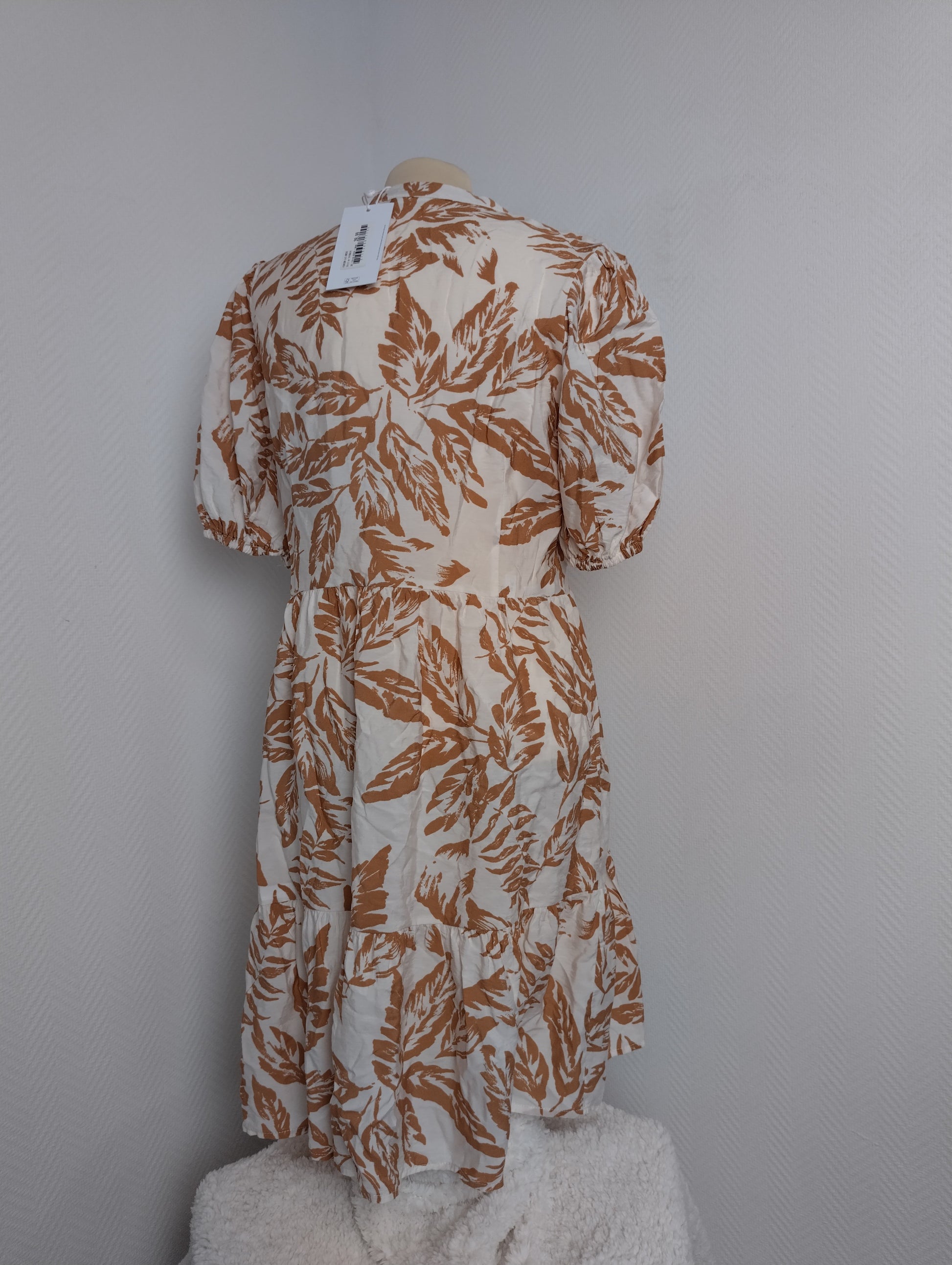 Back view of brown floral dress