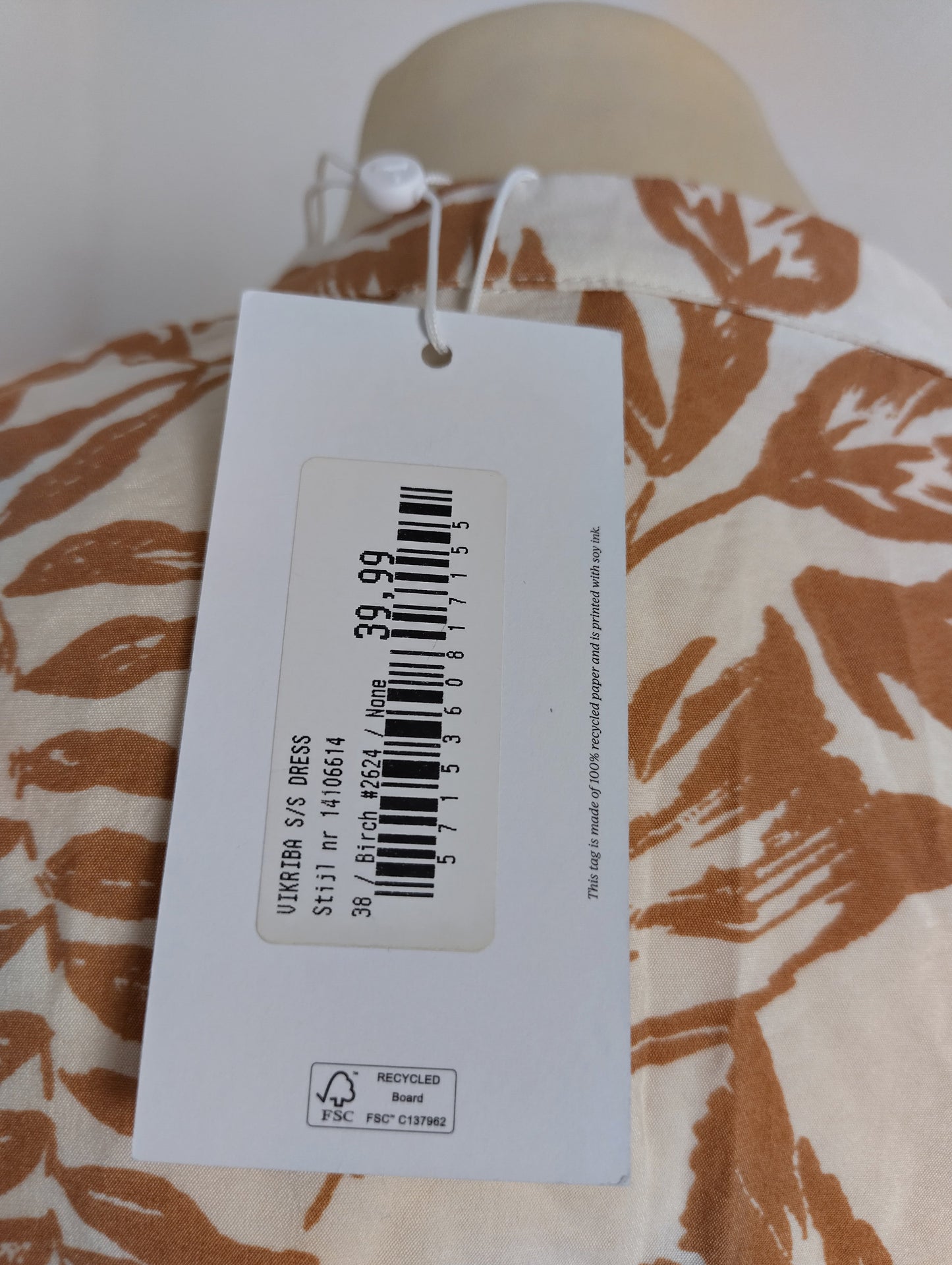 Price tag on brown floral dress