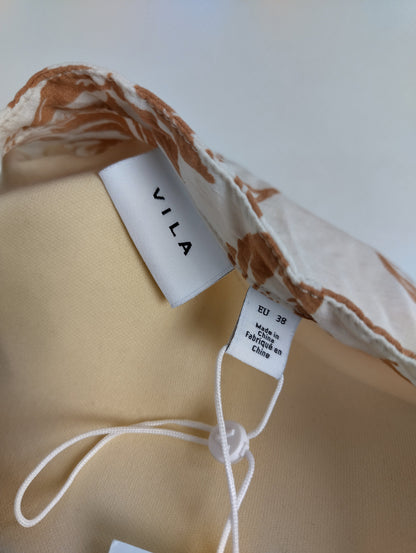 Brand label on brown floral dress