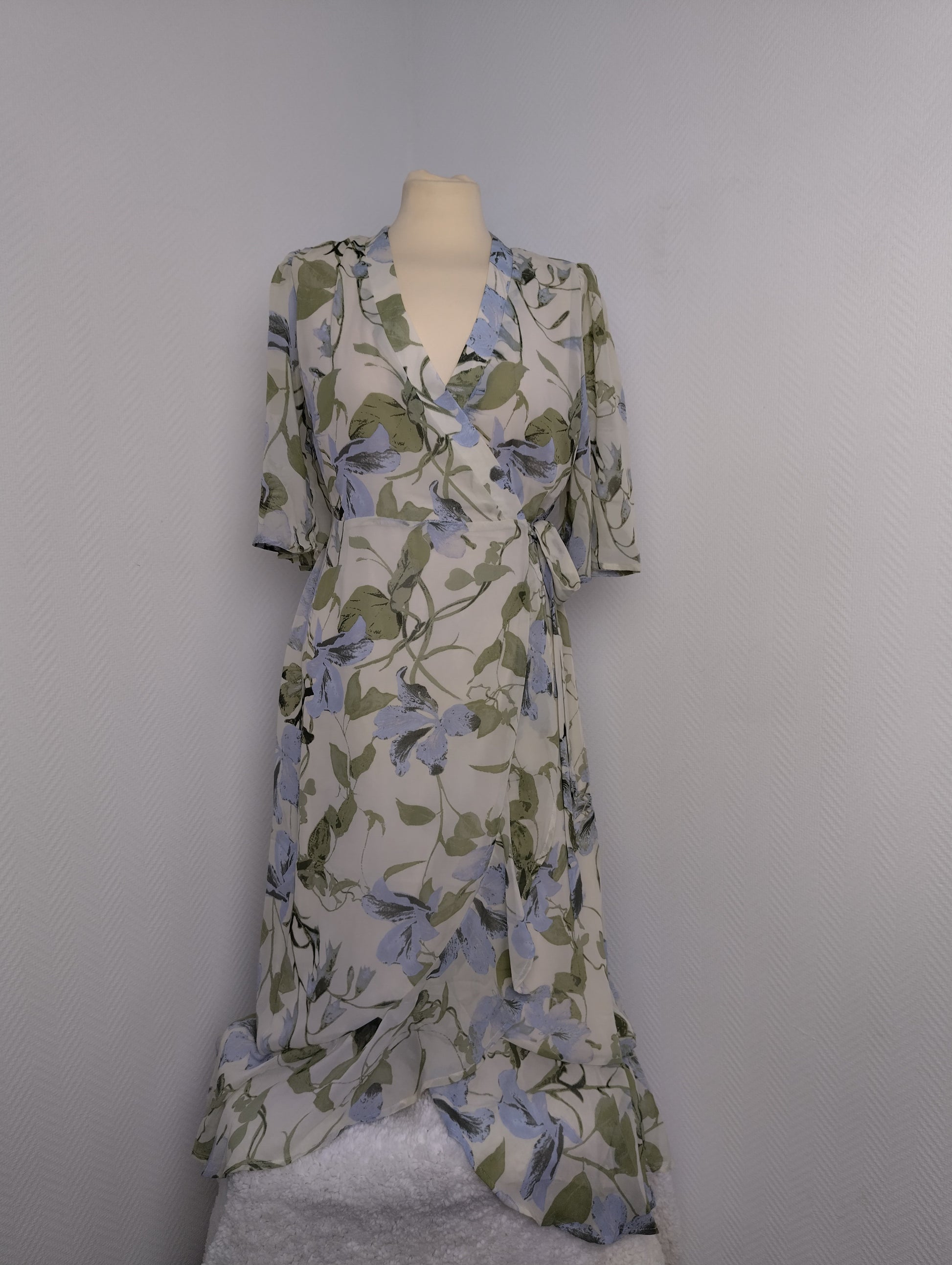 Floral wrap dress on mannequin from the front