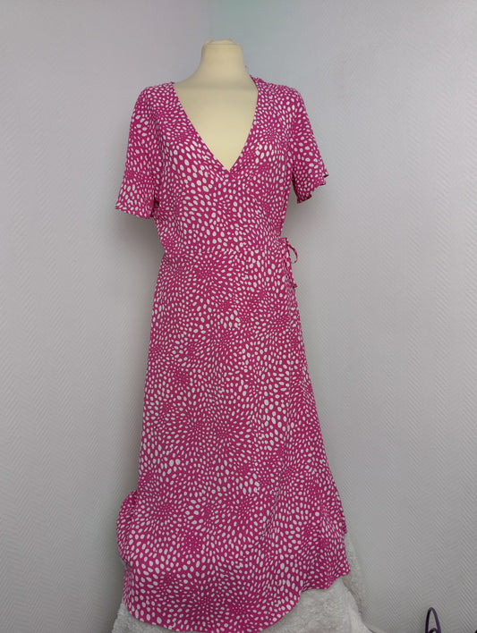 Front view of pink polka dot wrap dress by Vila