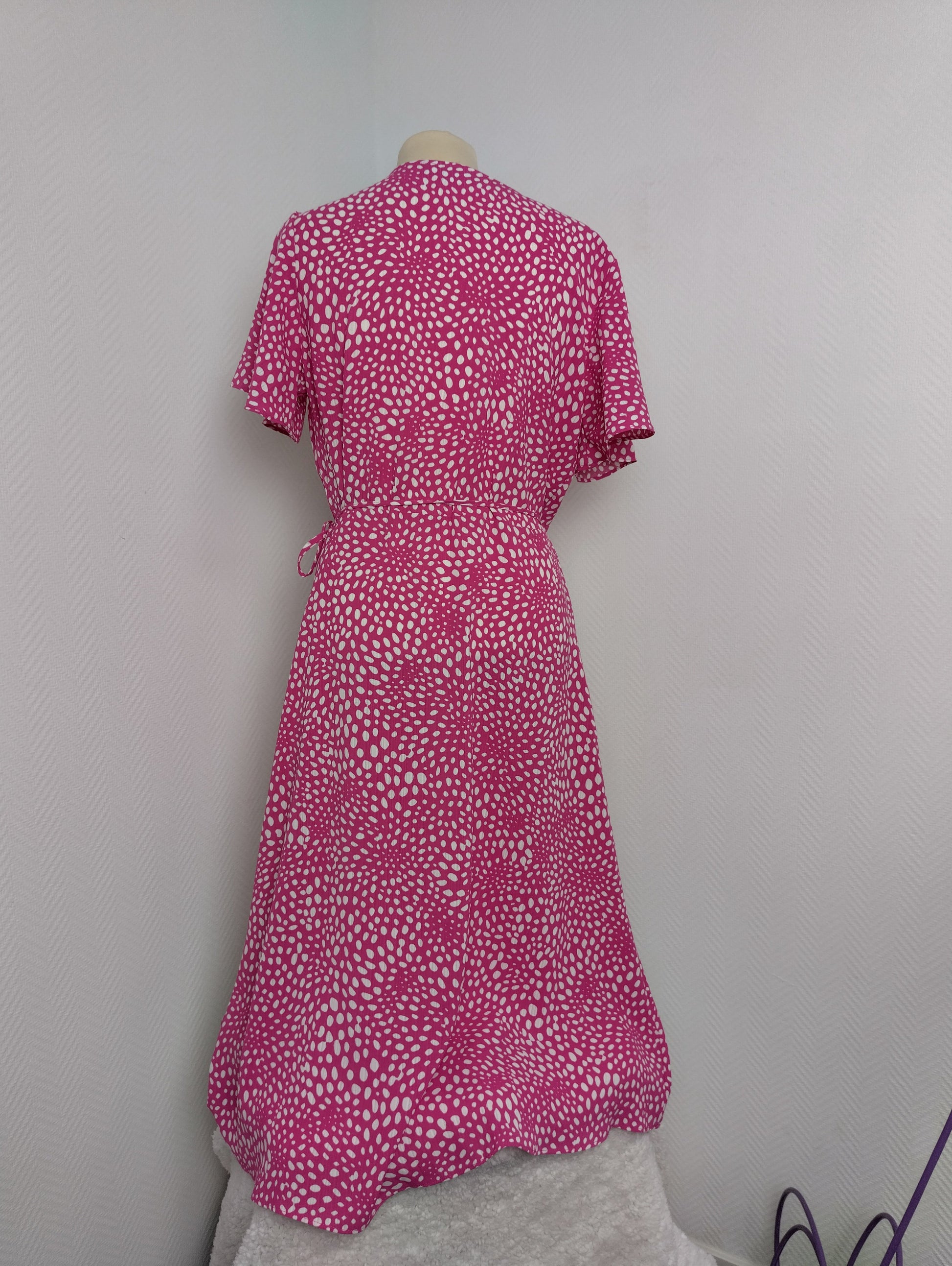 Back view of pink polka dot wrap dress by Vila