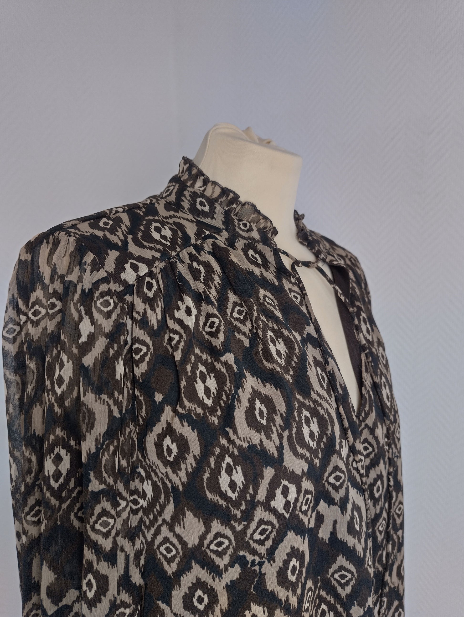 Side view of Vila patterned V-neck top